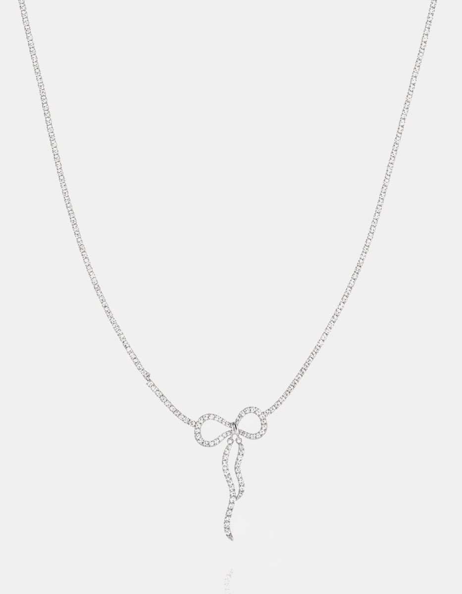 Collar en metales nobles con baño de platino, moño y topacios blancos · Festive Style