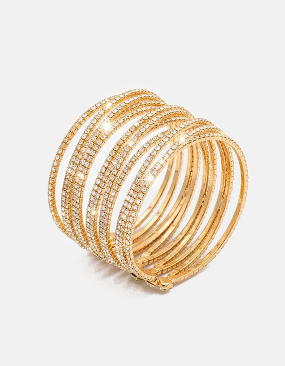 Brazalete de bronce con baño dorado de 12 líneas con topacios blancos Festive Style