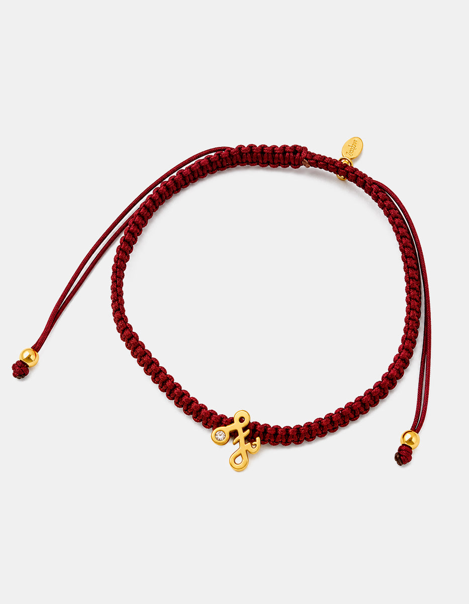 Pulsera con dije de metal noble con baño vermeil 22k con la letra Z y cordón trenzado