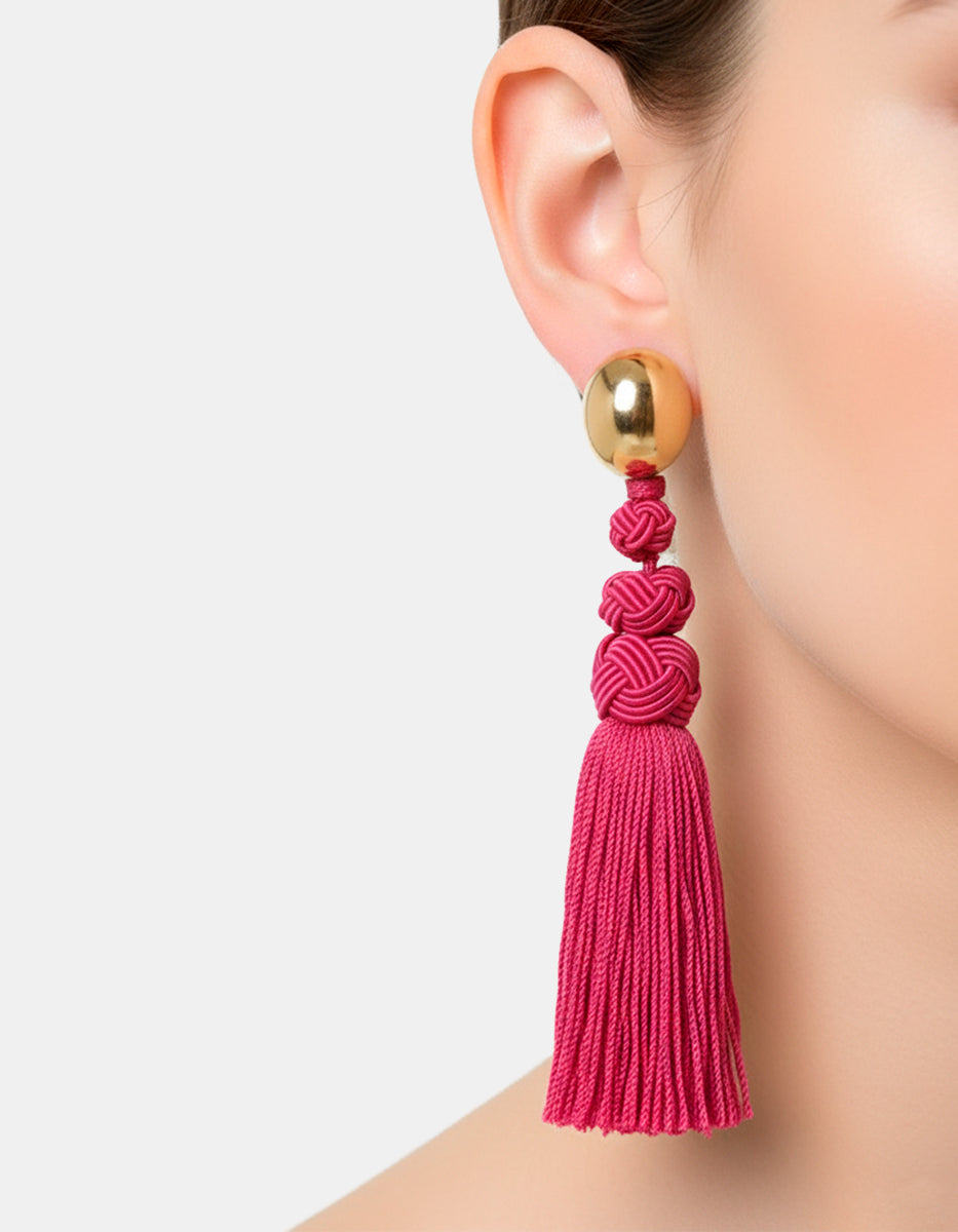 Aretes con pompones magenta Esplendida