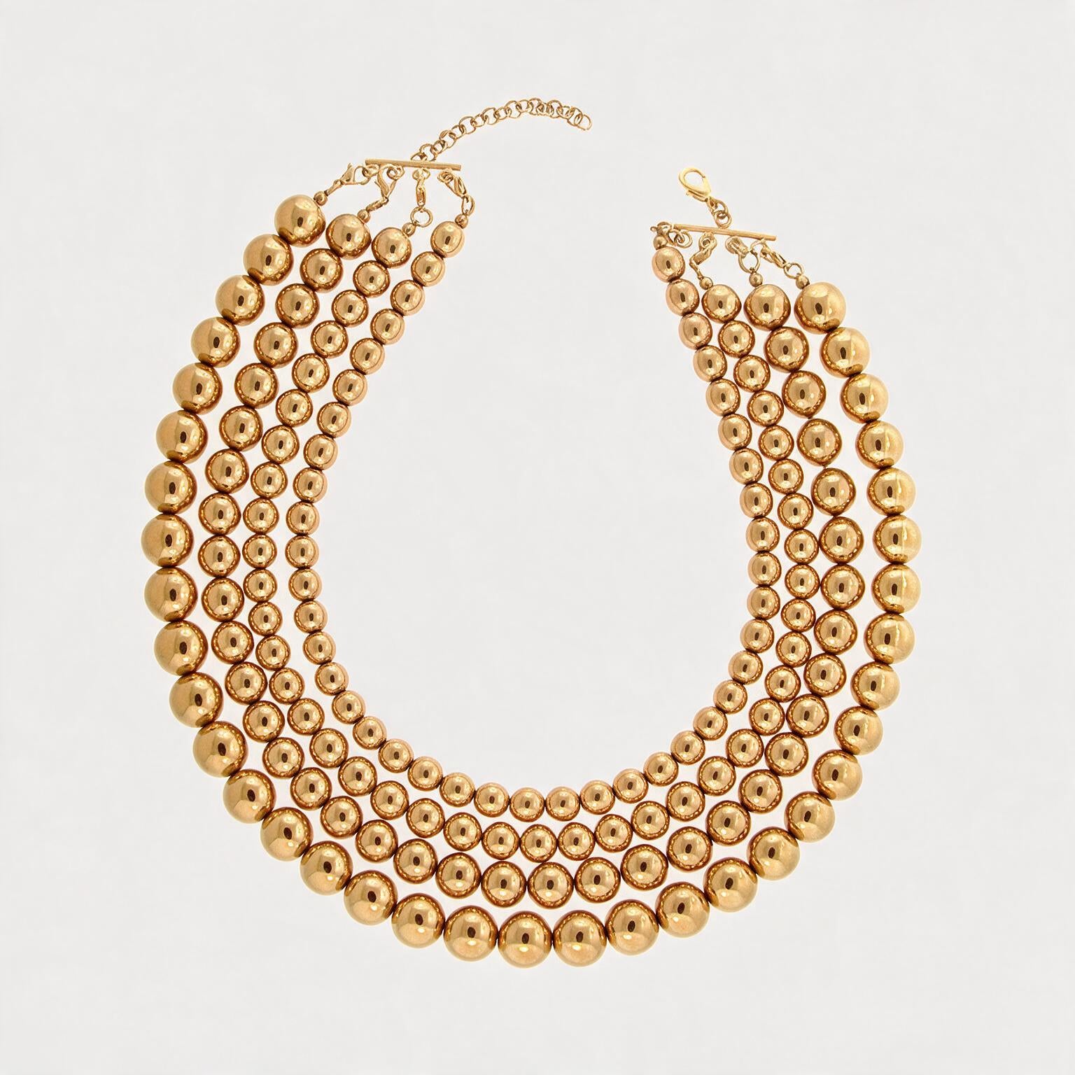 Collar de 4 hilos de bronce en baño de oro de 22kt con esferas en escala de tamaño Universe