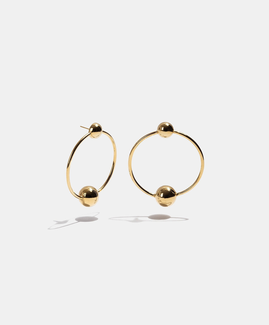 Aretes bronce baño oro 22kt Universe