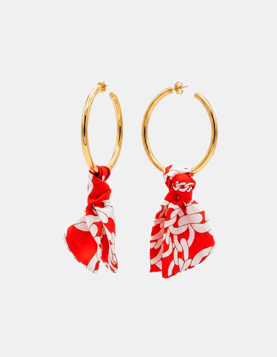 Arracadas de bronce en baño de oro 22k con detalle rojo