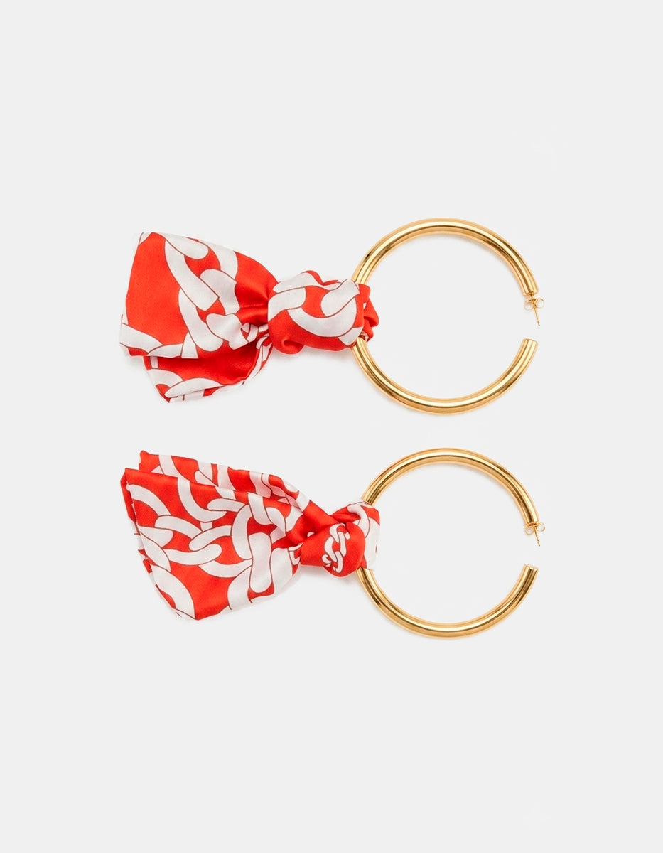 Arracadas de bronce en baño de oro 22k con detalle rojo