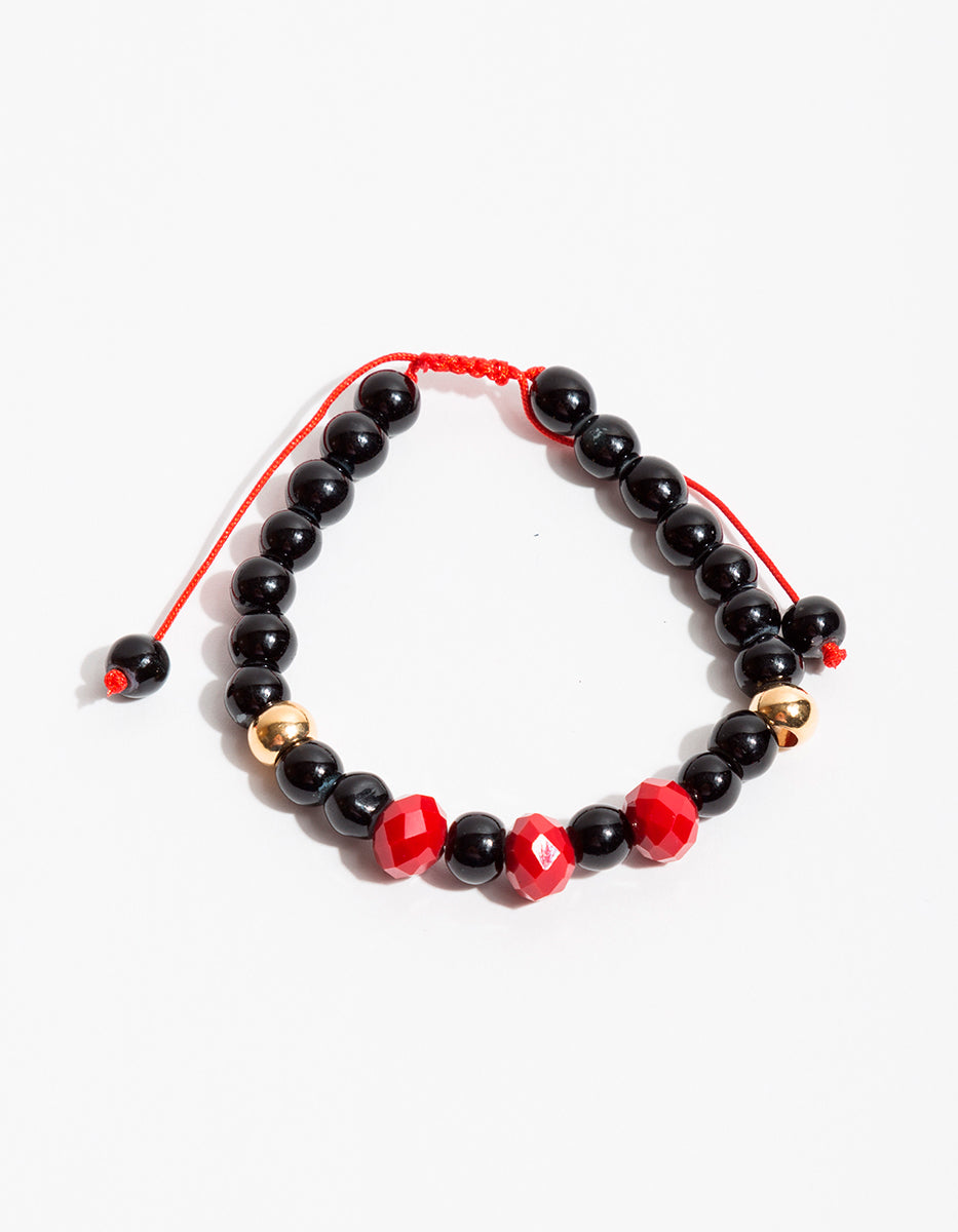Pulsera de bronce en baño de oro 22 kt con ágata negra y cristal austriaco rojo Nordic
