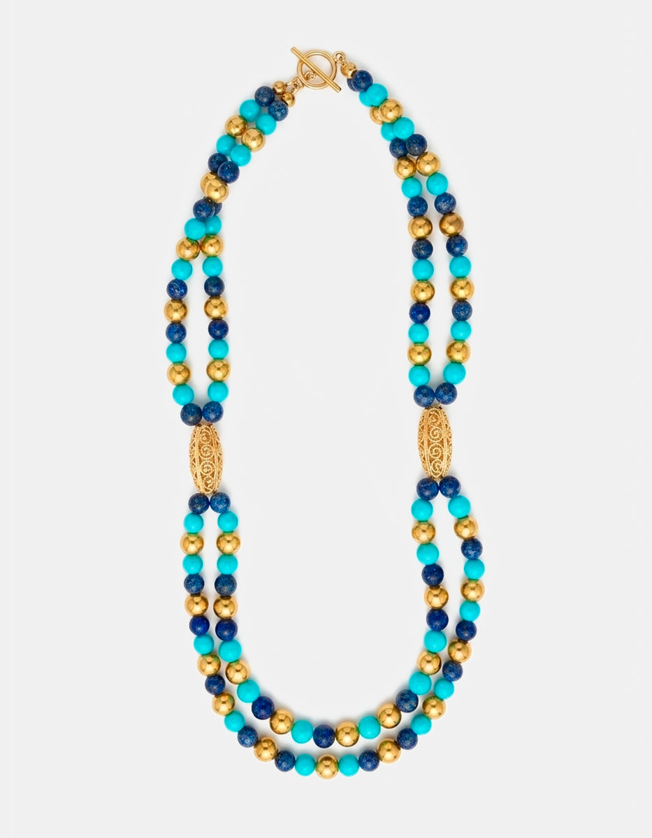 Collar doble hilera turquesa y azul con acentos de bronce en baño de oro de 22kt