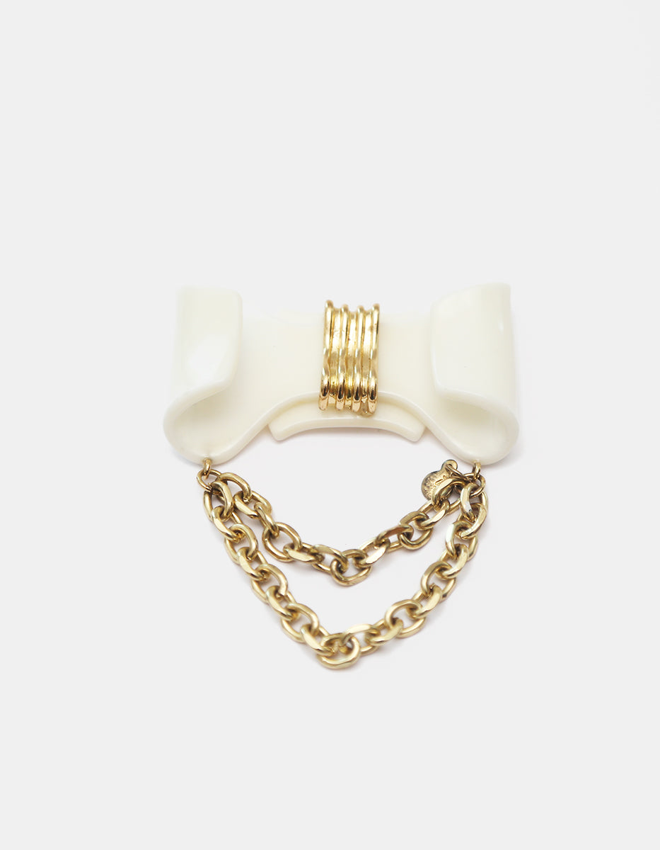 Prendedor con Moño de Acrílico Blanco con Cadenas en Gold-Filled de 22kt