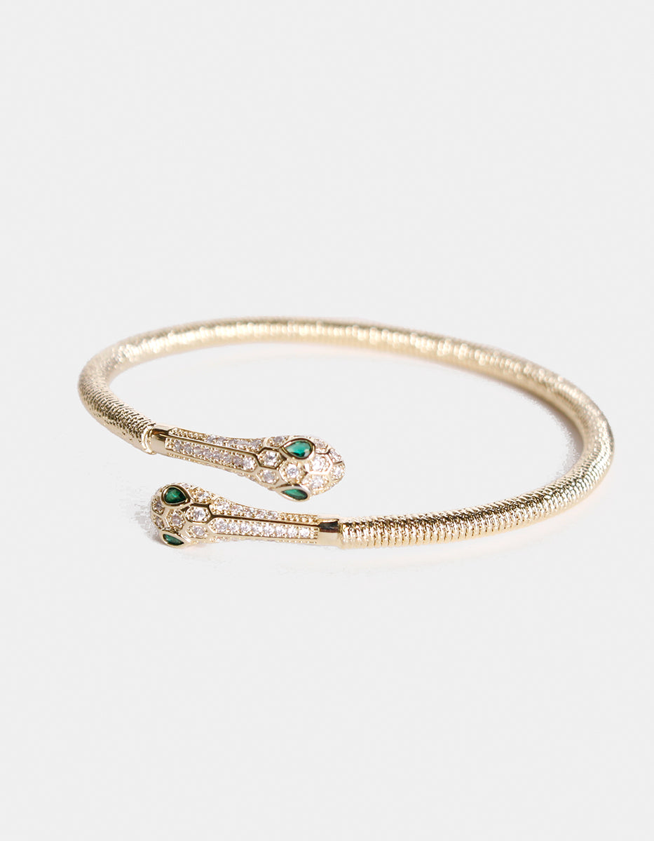 Brazalete en forma serpiente doble con topacios blancos y esmeralda de Bombay Festive Style