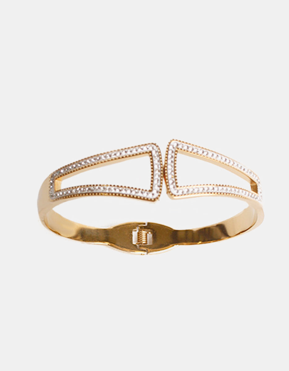 Brazalete de oro laminado con terminación calada y topacios blancos Golden Chic