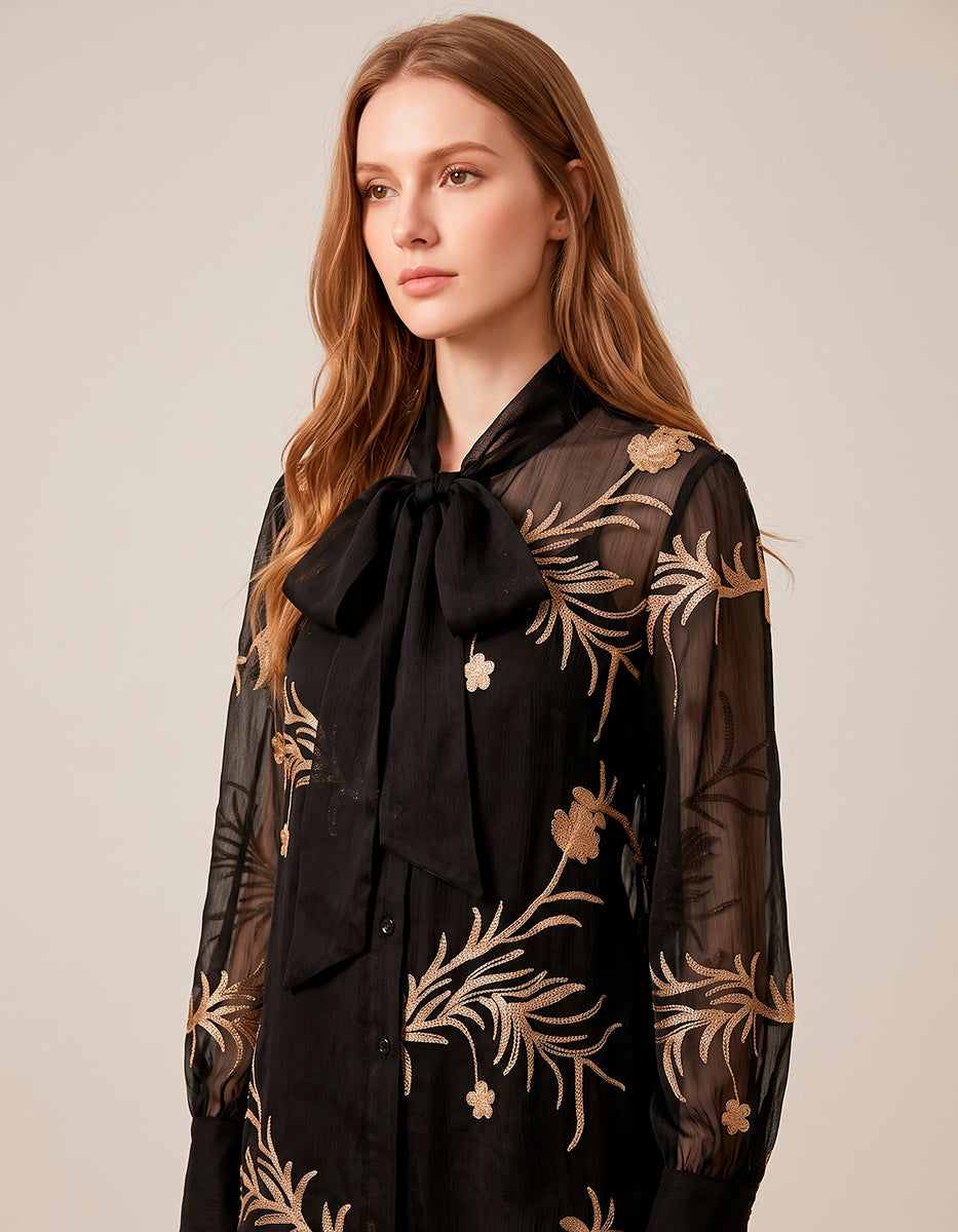 Blusa Translúcida Negra con Bordados Florales Dorados y Lazo al Cuello