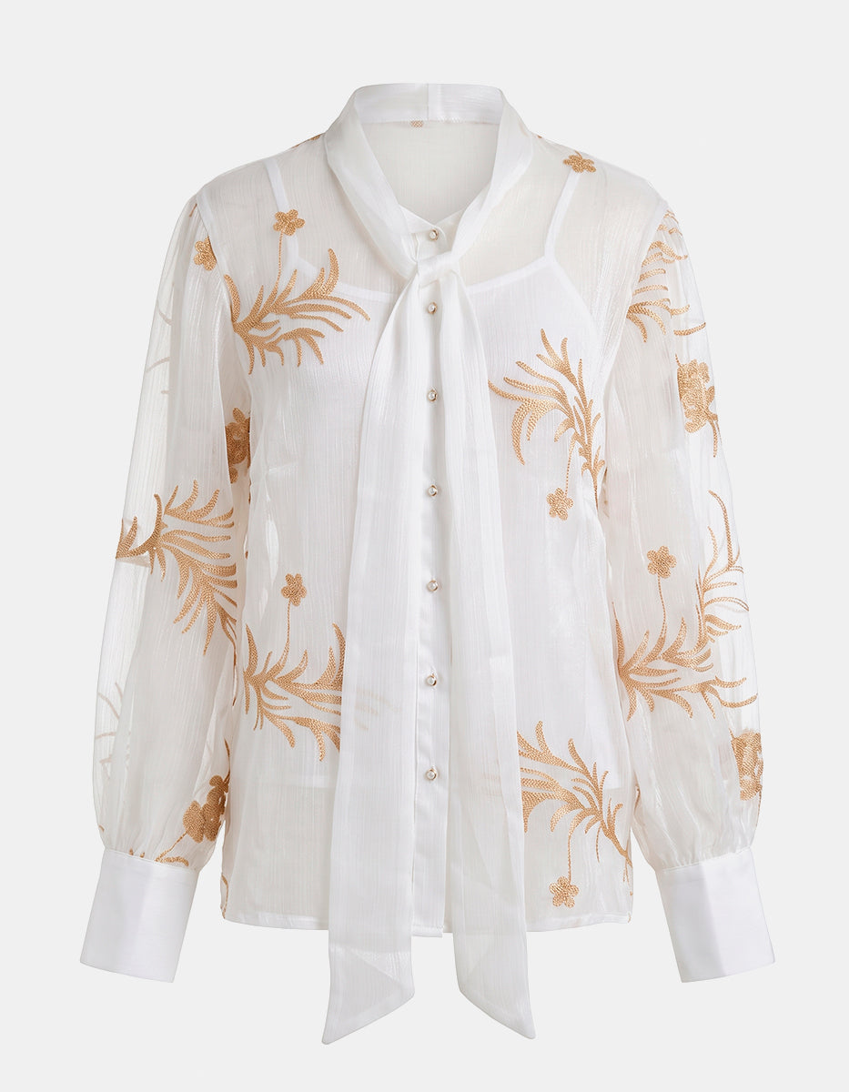 Blusa Translúcida Blanca con Bordados Florales Dorados y Lazo al Cuello
