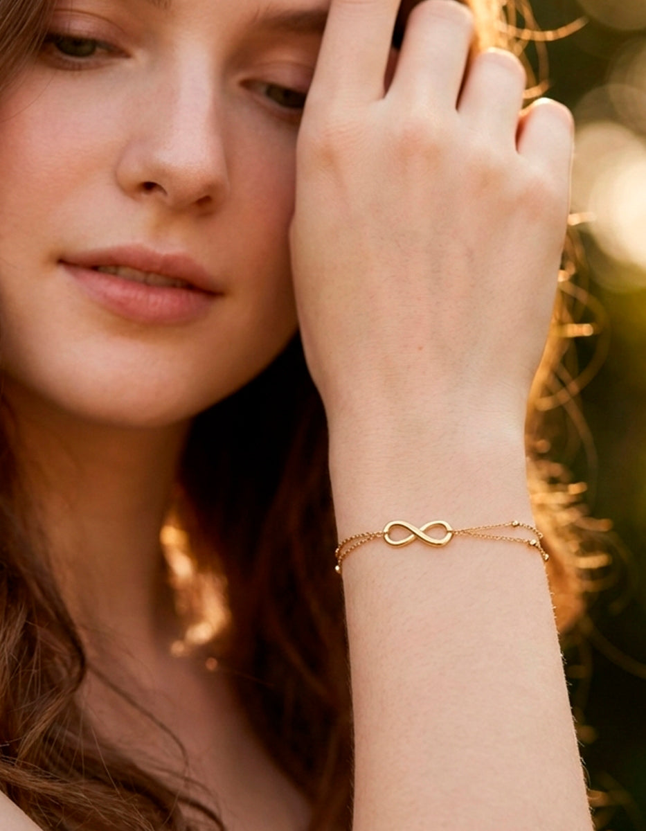 Pulsera de bronce con baño de oro de 22kt con símbolo infinito Love Story