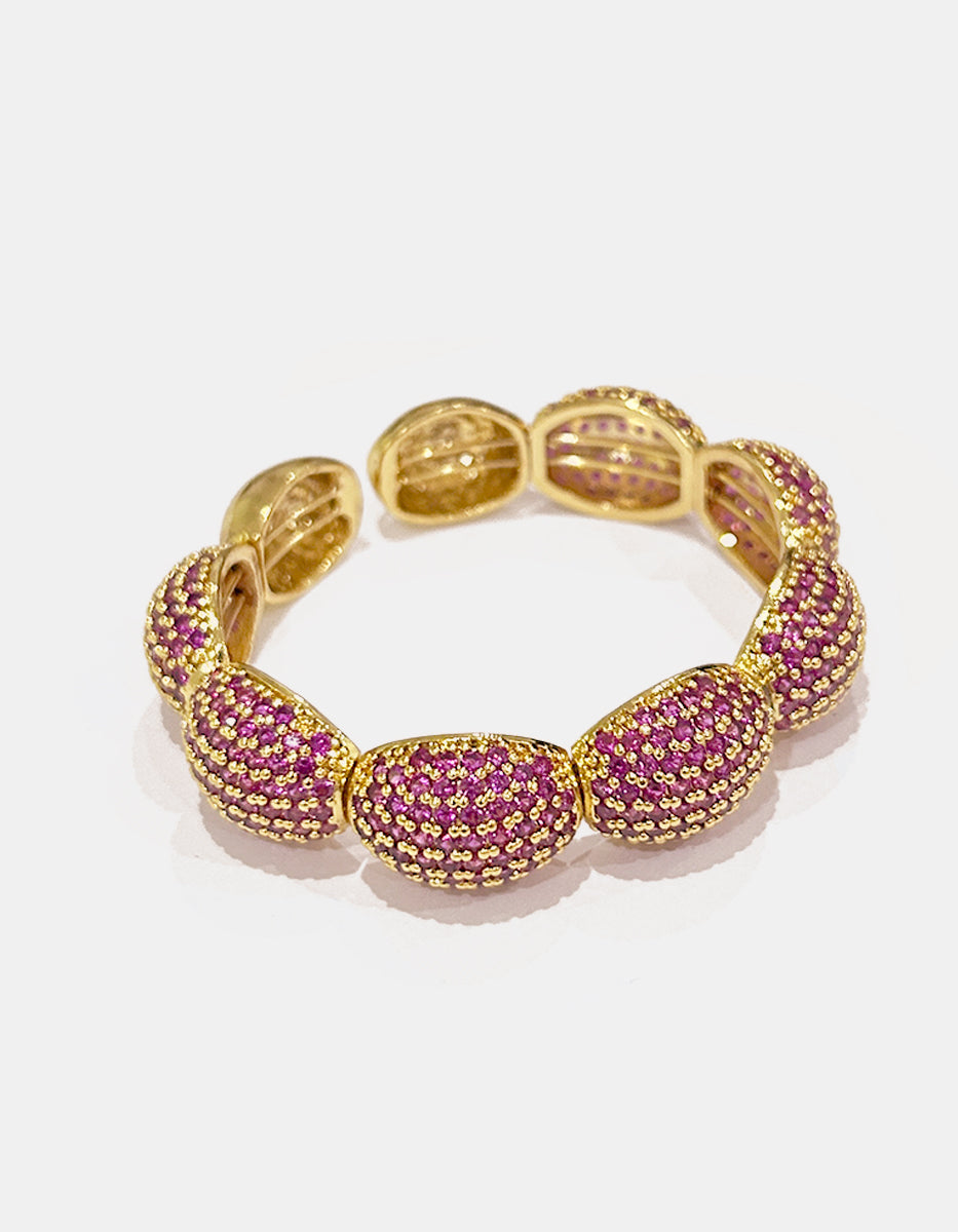 Brazalete de bronce con baño de oro 22k y topacio rosa en corte oval