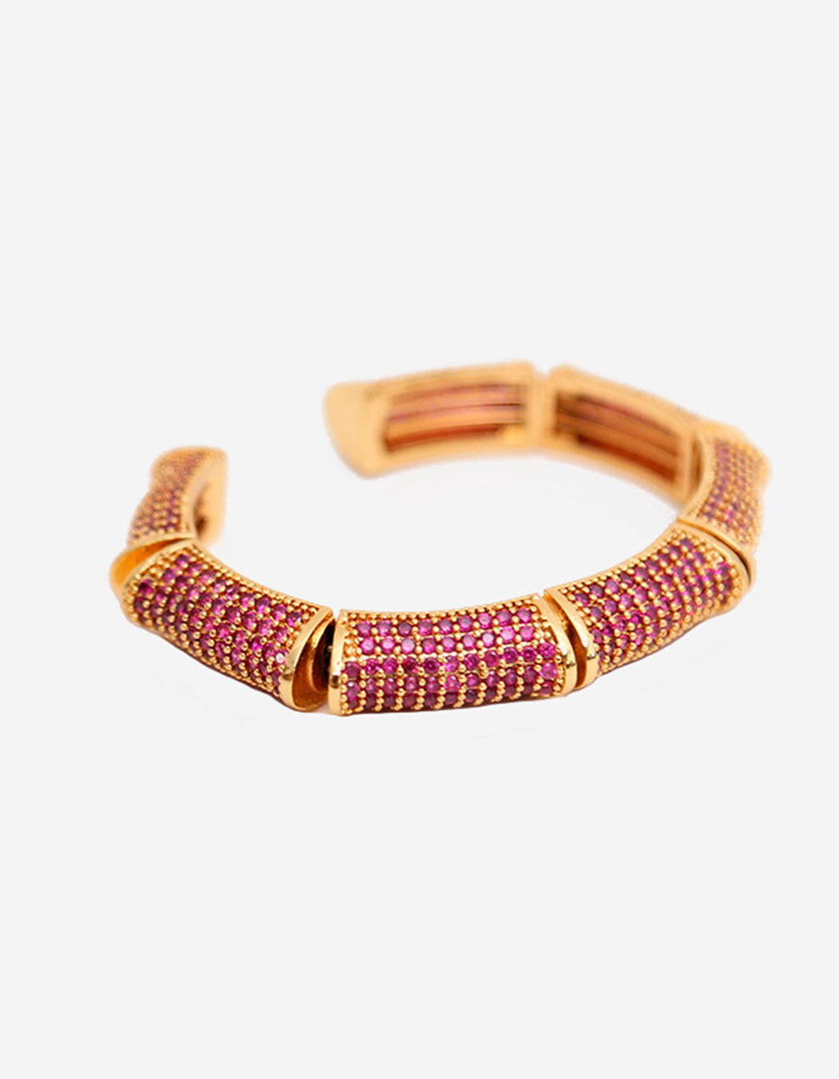Brazalete de bronce con baño de oro 22k y espinolitas color fucsia