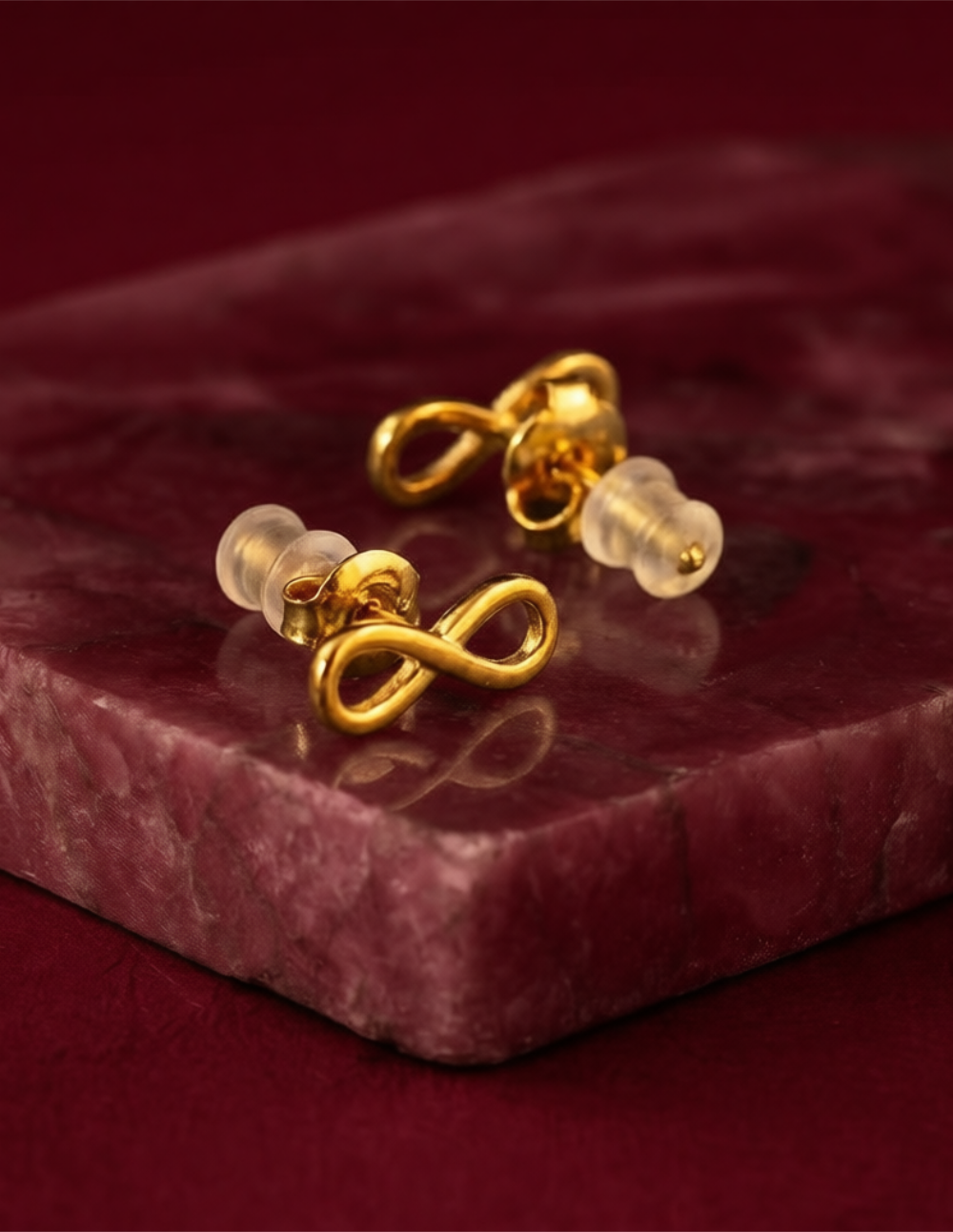 Broqueles de bronce en baño de oro de 22kt con símbolo de infinito Love Story