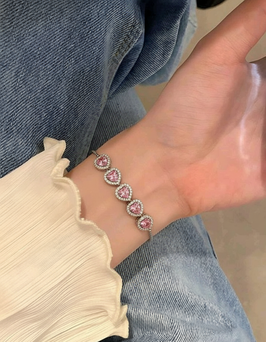 Pulsera ajustable en plata .925 con baño de rodio, cinco corazones y topacios rosas Love Story