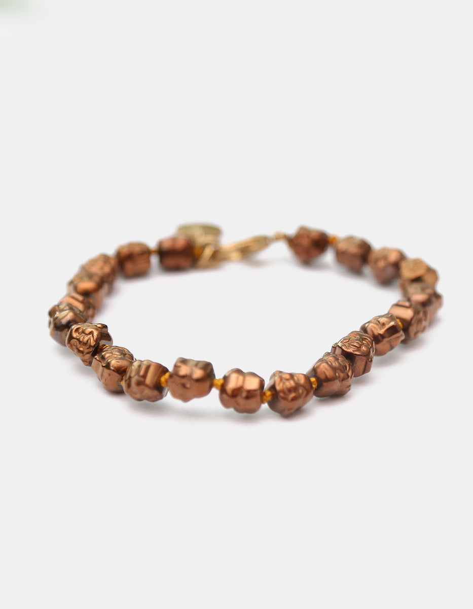 Pulsera de bronce acabado brillante con cabezas de Buda Nordic