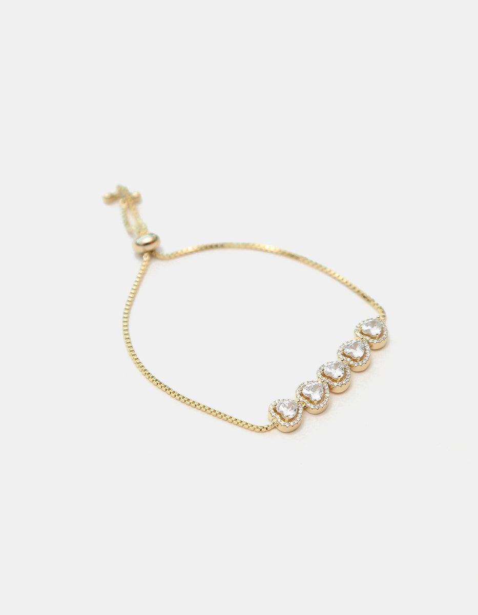 Pulsera ajustable en plata .925 con baño de oro 22 kt, cinco corazones y topacios blancos Amor Eterno