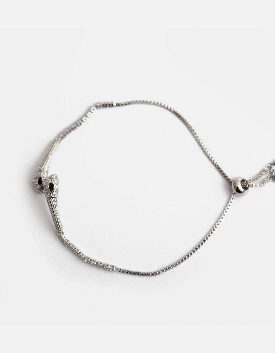 Pulsera ajustable en plata .925 con baño de rodio, serpientes, topacios blancos y esmeralda de Bombay Festive Style