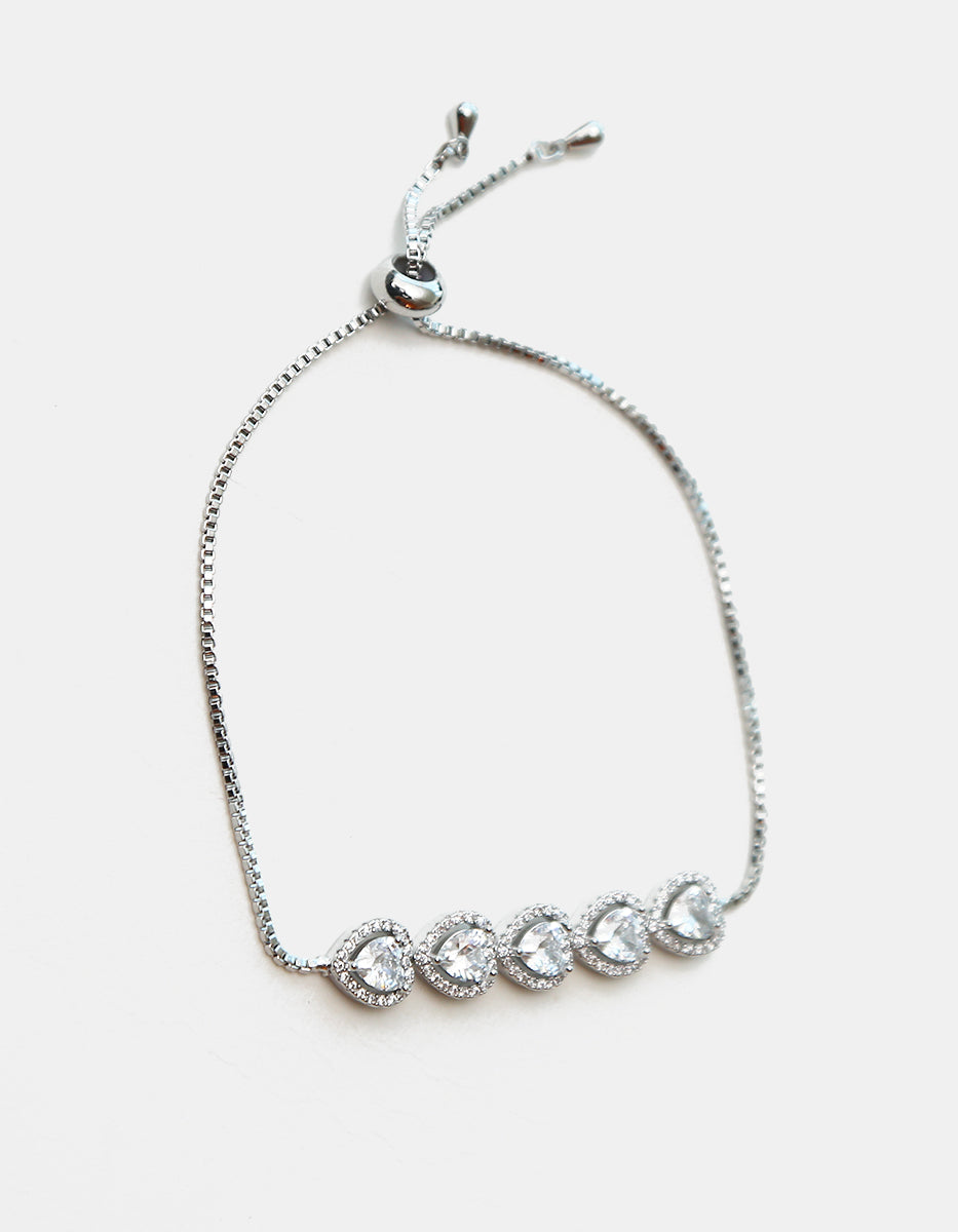 Pulsera ajustable en plata .925 con baño de rodio, cinco corazones y topacios blancos Amor Eterno
