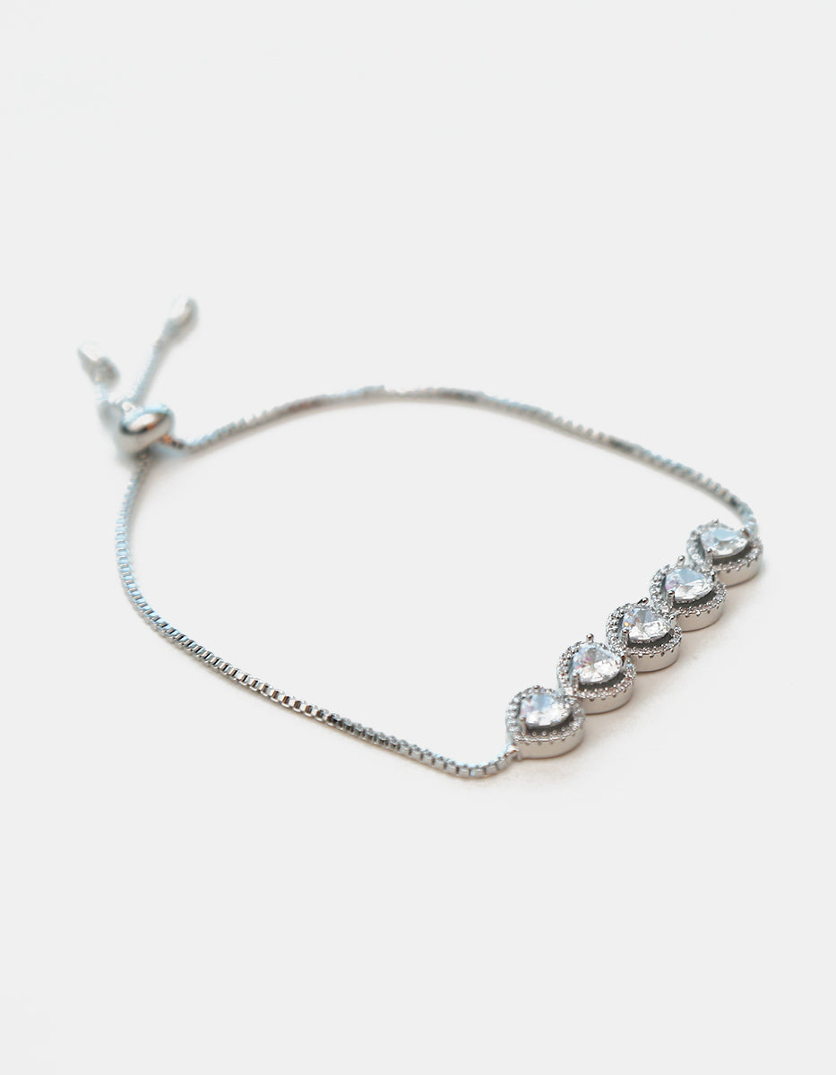 Pulsera ajustable en plata .925 con baño de rodio, cinco corazones y topacios blancos Amor Eterno