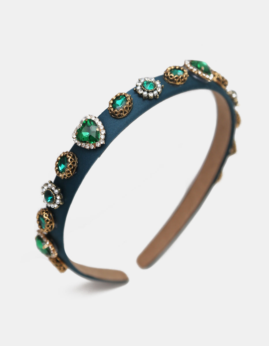 Diadema de terciopelo con cristales facetados verde esmeralda y ornamentos dorados