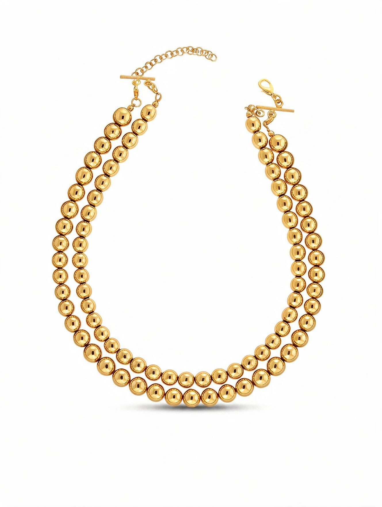Collar de 2 hilos de bronce en baño de oro de 22kt con esferas en escala de tamaño Universe