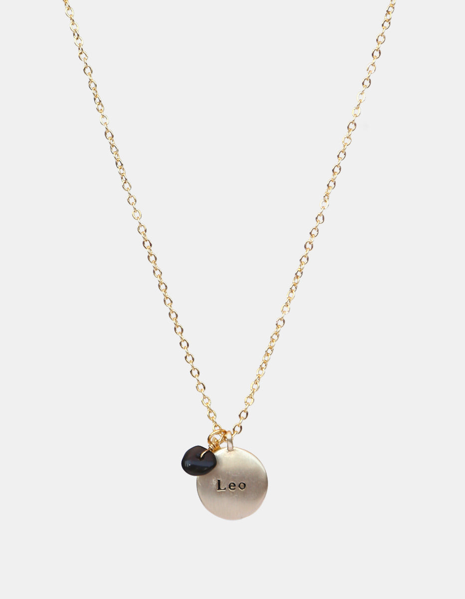 Collar de bronce con dije Leo en baño de oro laminado mate y topacios blancos Zodiac