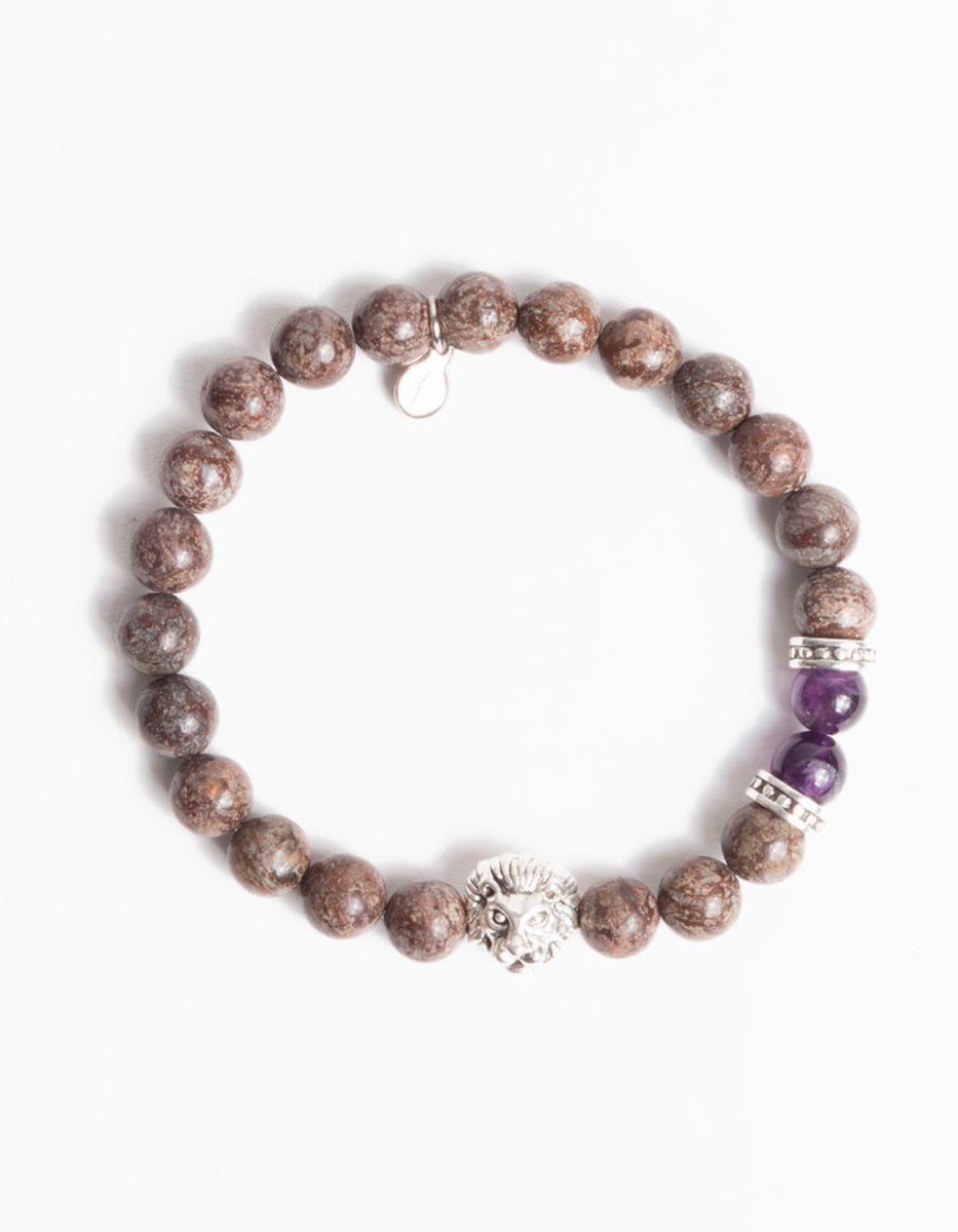 Pulsera de bronce en baño de rodio con obsidiana copo de nieve roja y dije con cabeza de león Nordic