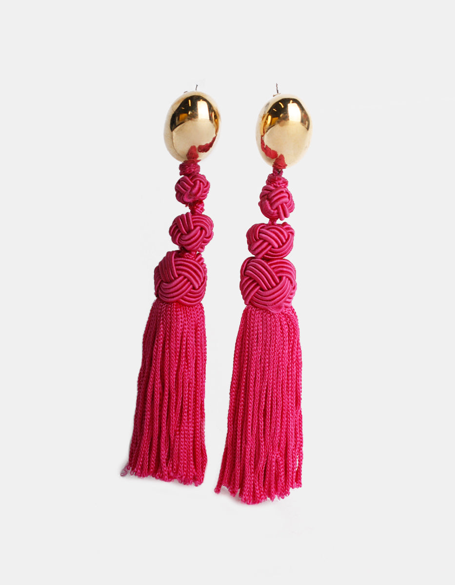 Aretes con pompones magenta Esplendida