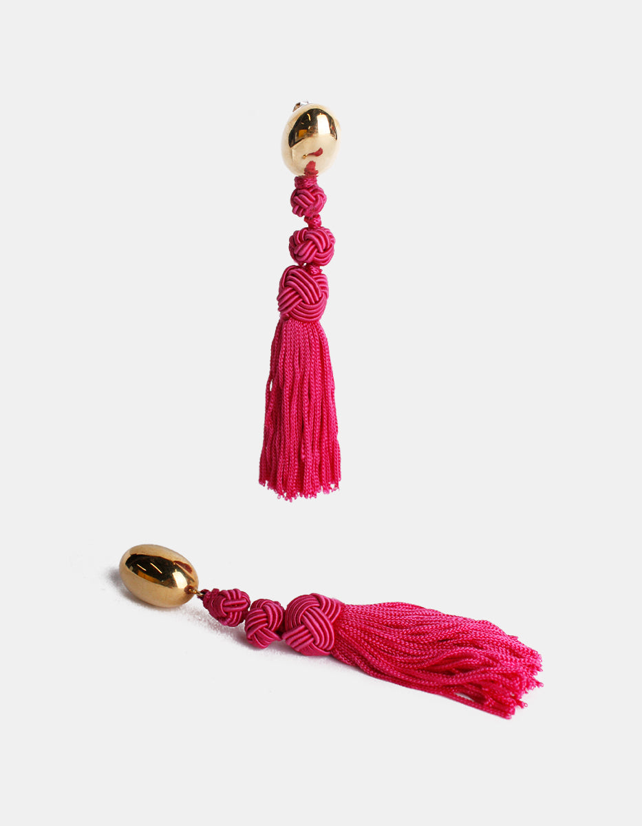 Aretes con pompones magenta Esplendida