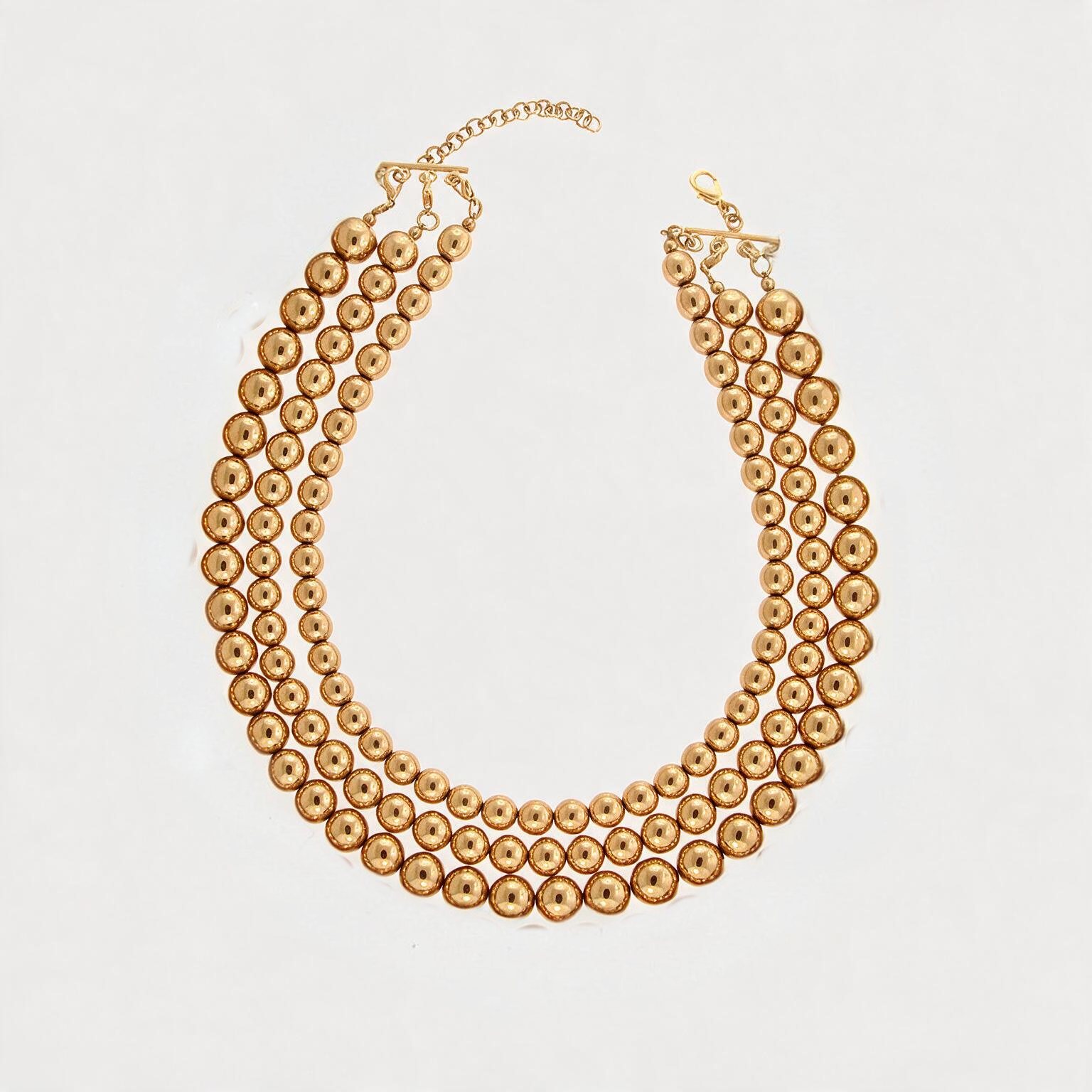 Collar de 3 hilos de bronce en baño de oro de 22kt con esferas en escala de tamaño Universe