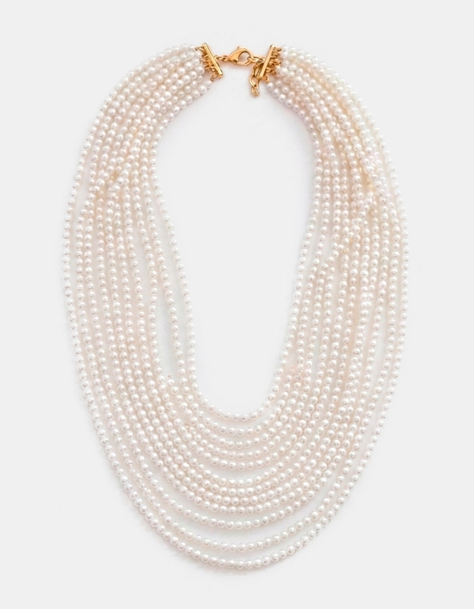 Collar de bronce en baño de oro 22 kt con perla mabe y múltiples hilos