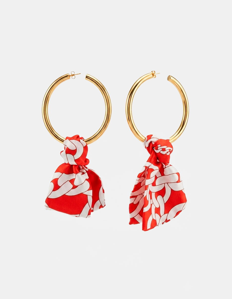 Arracadas de bronce en baño de oro 22k con detalle rojo