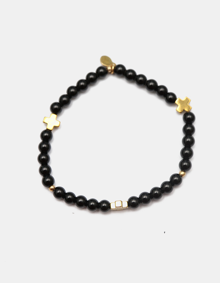 Pulsera ónix con cruces doradas Nordic