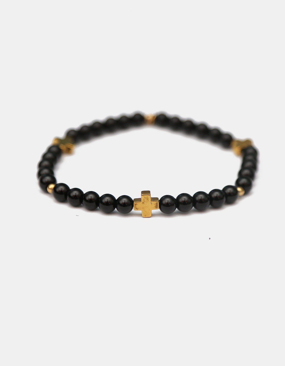 Pulsera ónix con cruces doradas Nordic