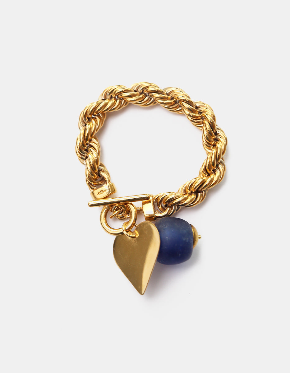 Pulsera de bronce en baño de oro 22 kt con hoja y cristal azul rey