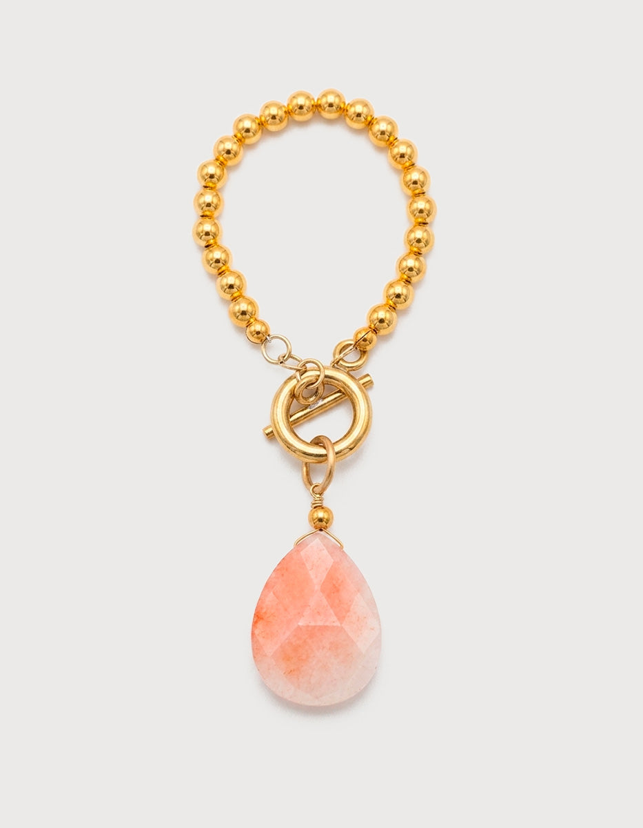 Pulsera de Oro Laminado 22 kt con esferas Doradas y Cherry Quartz en Corte Gota