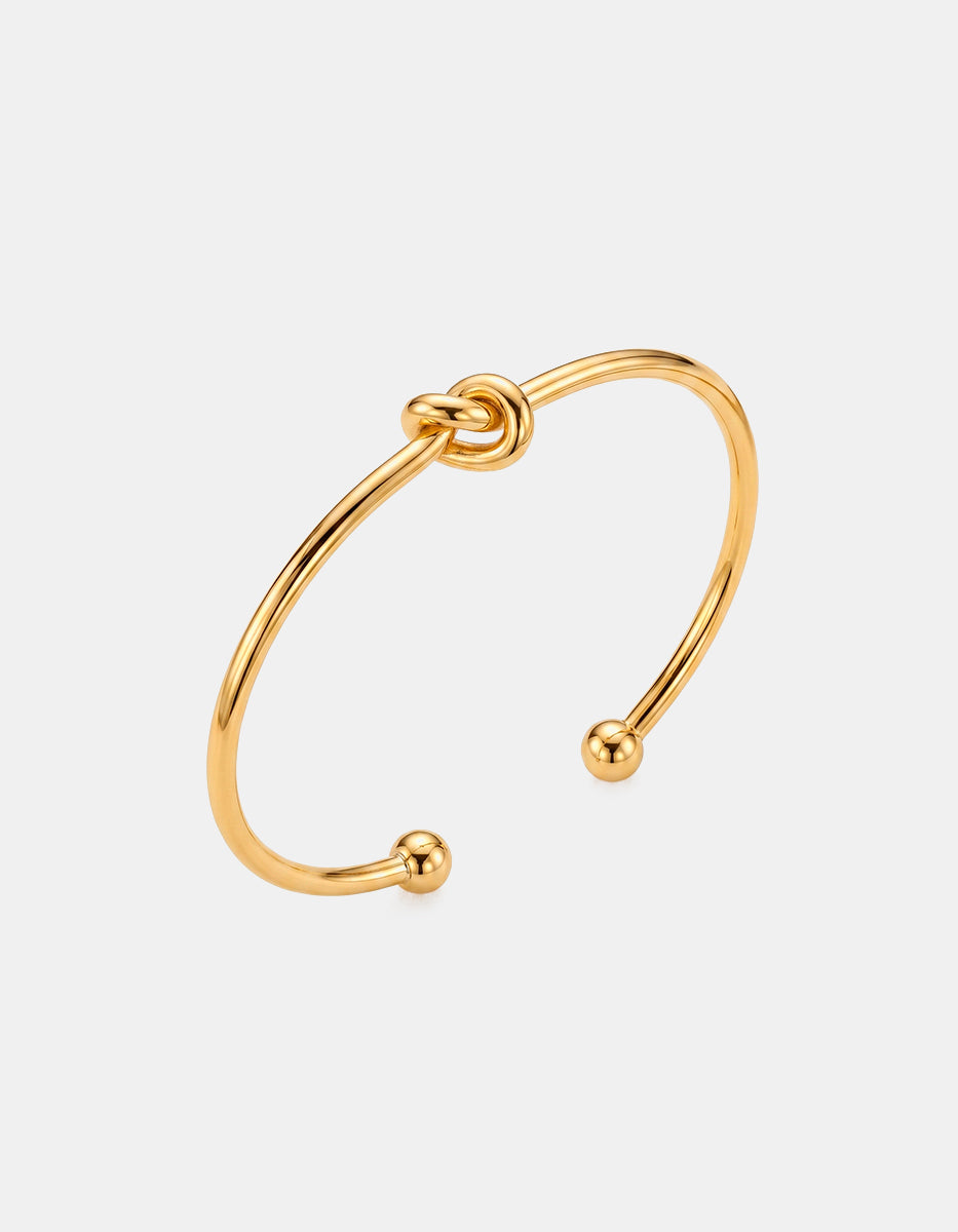 Brazalete de oro laminado 22kt con nudo central Golden Chic