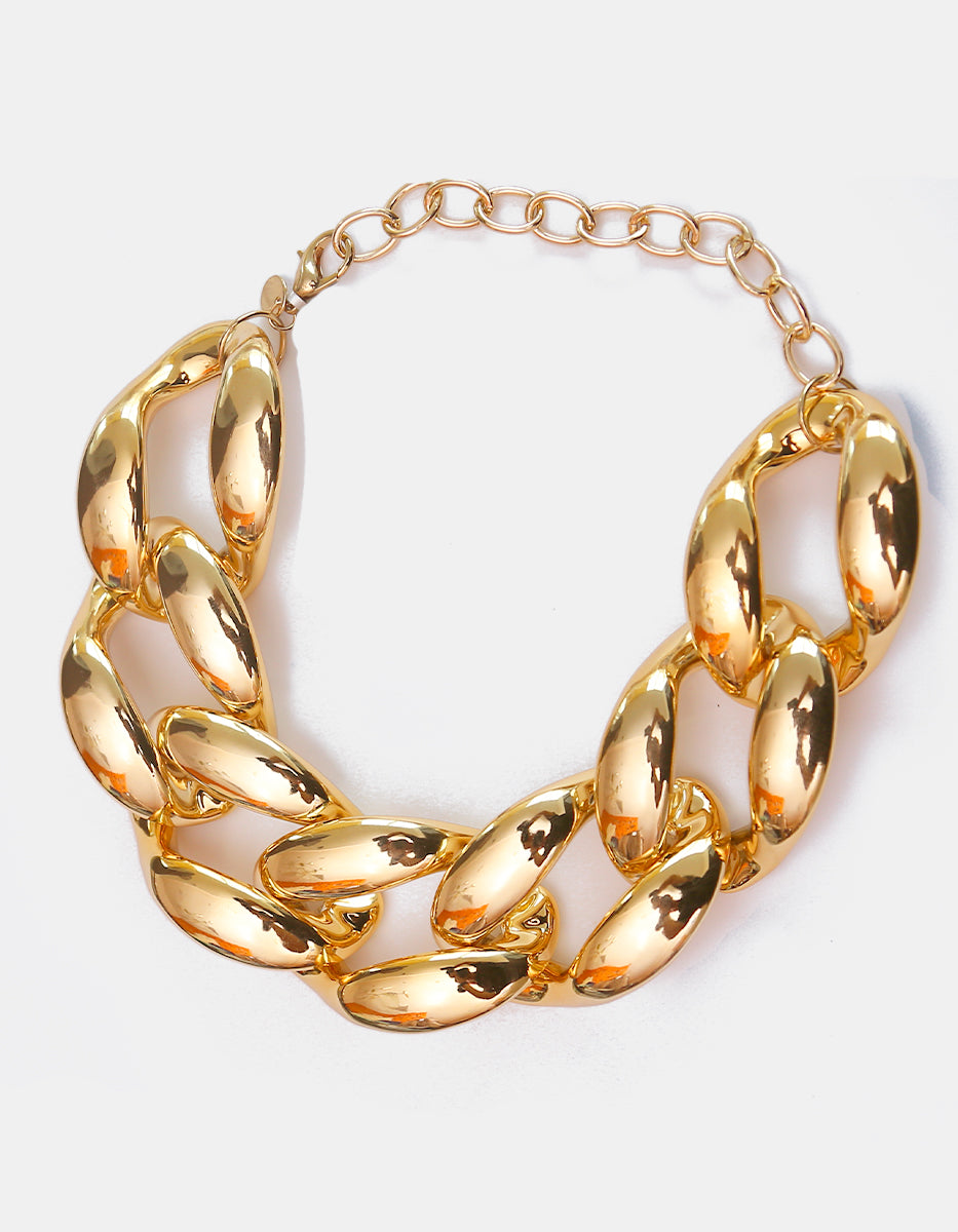 Collar de eslabones acrílicos dorados con cadena en bronce con baño de oro de 22kt