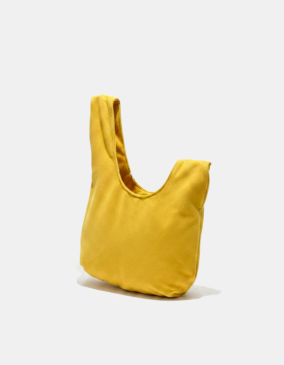 Bolso asimétrico liso amarillo con forro negro