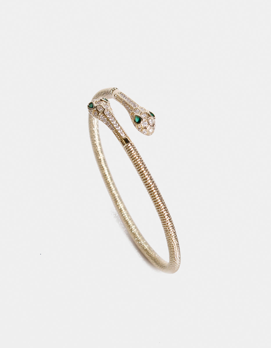 Brazalete en forma serpiente doble con topacios blancos y esmeralda de Bombay Festive Style