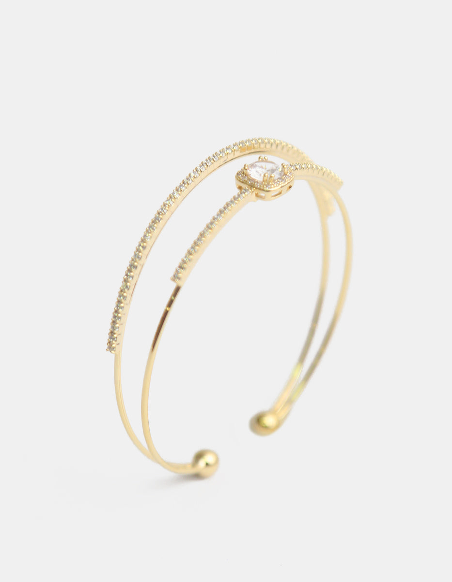 Brazalete con baño de oro 22 kt doble hilo con topacios blancos Festive Style
