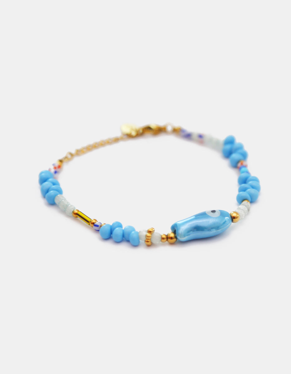 Pulsera de baquelita albiazul en Gold-Filled con pez de cerámica azul Ultramar