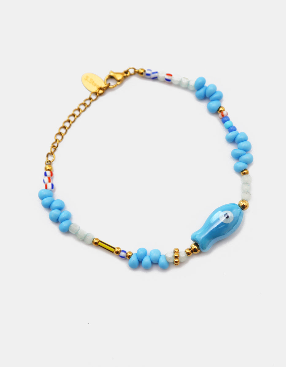 Pulsera de baquelita albiazul en Gold-Filled con pez de cerámica azul Ultramar