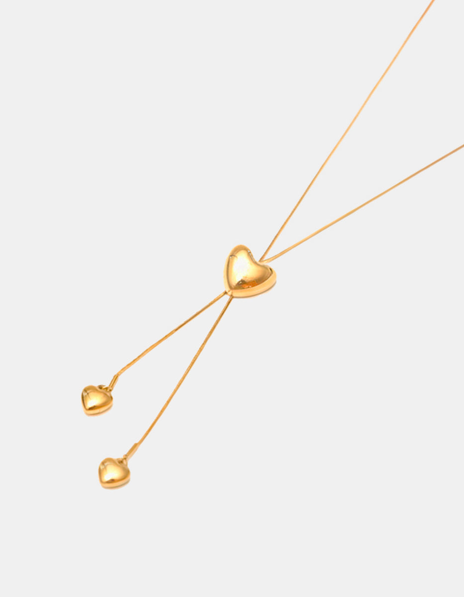 Collar en bronce con baño de oro 22 kt y dije de corazón con doble caída de corazones mini Love Story