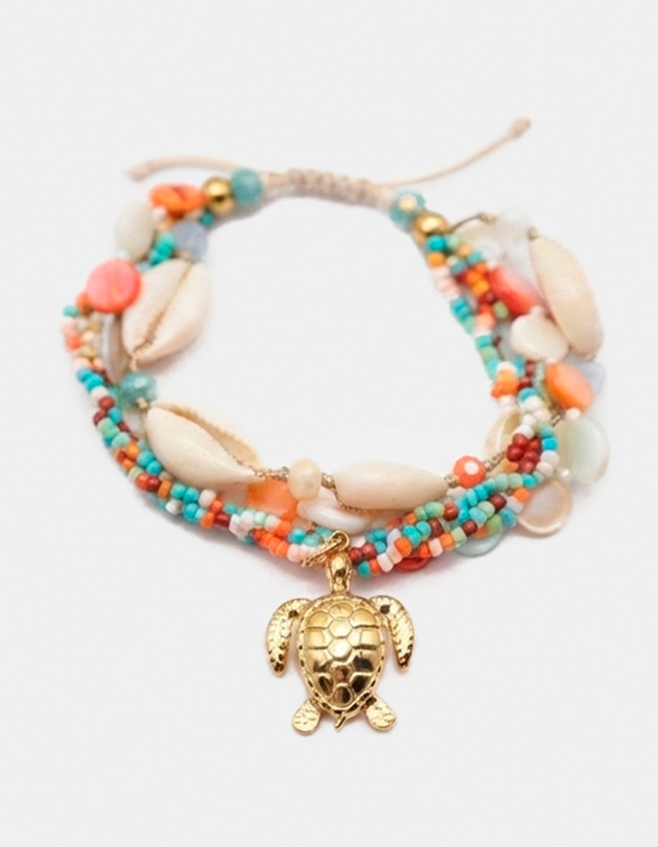 Pulsera de motivos marinos y charm de tortuga de bronce en baño de oro de 22kt Ultramar