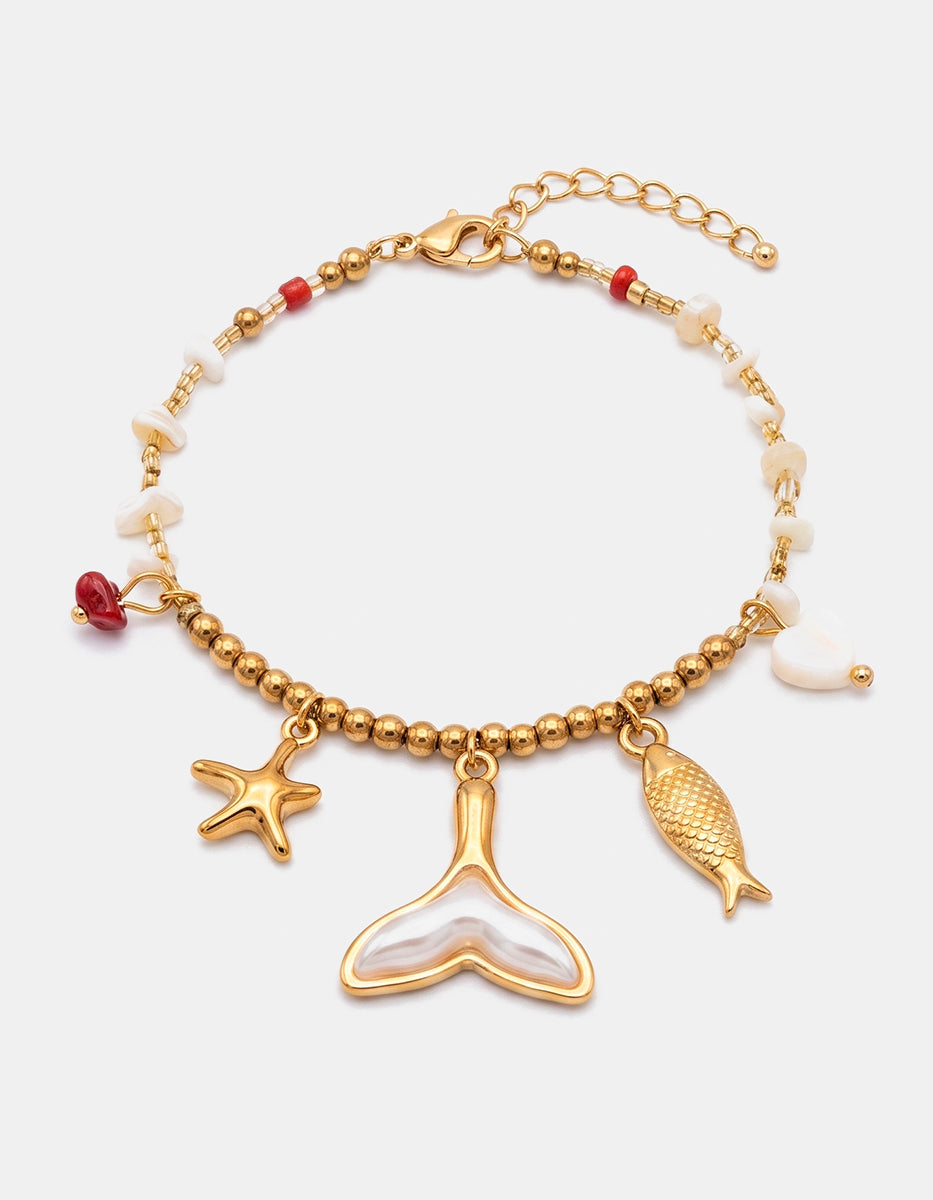 Pulsera de Gold-Filled con dije de cola de ballena en madreperla y charms marinos Ultramar