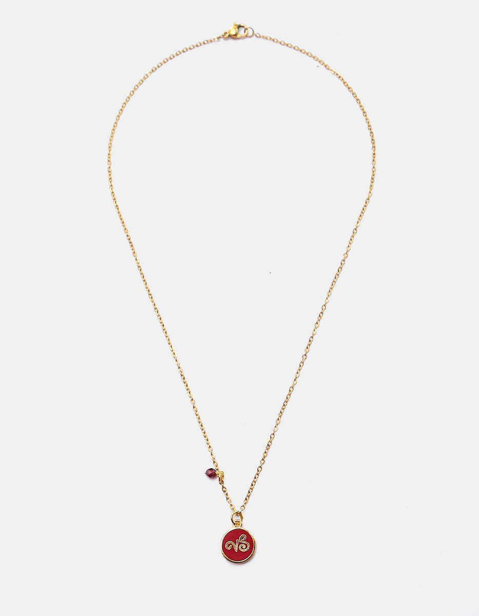 Collar Gold-Filled de 22kt con charm esmaltado de Capricornio y cristal austriaco rojo Zodiac