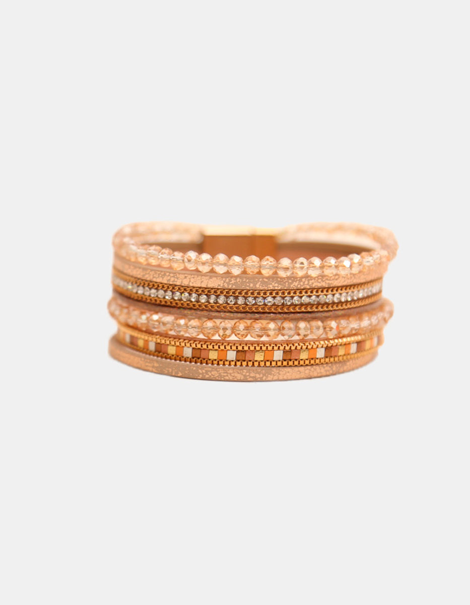 Pulsera de oro laminado 22k de seis hilos con cristal austriaco tono café y detalles geométricos